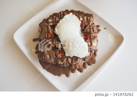 Delicious dessert with chocolate and ice cream Delicious dessert with chocolate and ice cream 141978262