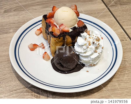 Honey Toast With Ice Cream and Strawberries Honey Toast With Ice Cream and Strawberries 141979556