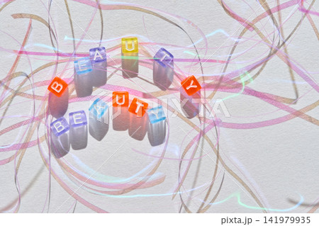 Colorful Cube Letter Beads Spelling Beauty Arranged In Semicircle On Textured White Paper Colorful Cube Letter Beads Spelling Beauty Arranged In Semicircle On Textured White Paper 141979935