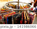 Colorful Women Clothes Hanging on Rack in Boutique Store 141986066