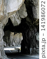 Mountain Road Tunnel Carved Through Rock 141986072