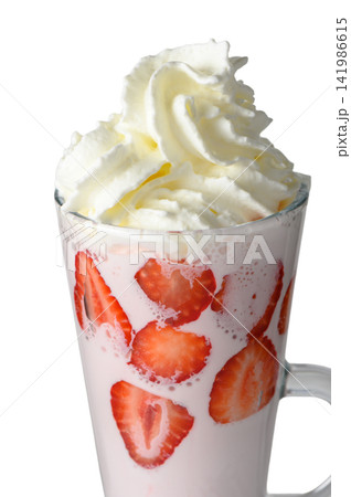 Close-up of strawberry milkshake with whipped cream in a tall glass mug Close-up of strawberry milkshake with whipped cream in a tall glass mug 141986615