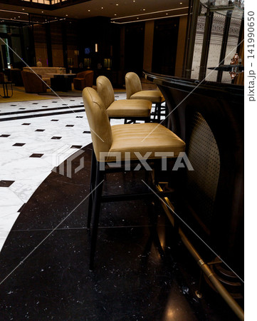 Leather bar stools at luxury hotel bar counter. Leather bar stools at luxury hotel bar counter. 141990650