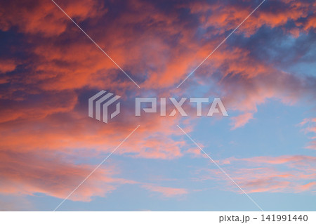 Vibrant sunset sky with pink and purple clouds illuminating the evening atmosphere natural dusk environment space Vibrant sunset sky with pink and purple clouds illuminating the evening atmosphere natural dusk environment space 141991440