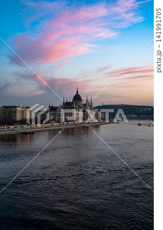 Hungarian Parliament Building at Sunset Over the Danube River in Budapest Hungarian Parliament Building at Sunset Over the Danube River in Budapest 141991705