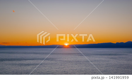 Sunset over ocean with mountain silhouette in Kanagawa Sunset over ocean with mountain silhouette in Kanagawa 141991959