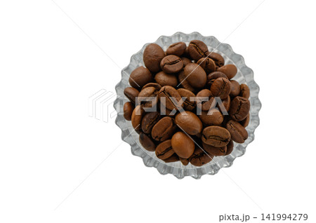 Overhead Shot of Roasted Coffee Beans in a Scalloped Glass Bowl Overhead Shot of Roasted Coffee Beans in a Scalloped Glass Bowl 141994279