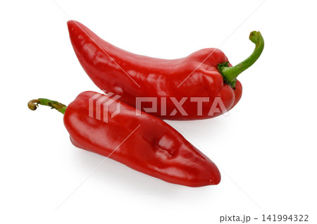 Two Vibrant Red Peppers on White Background 141994322