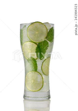 Glass of refreshing mojito cocktail with lime slices and mint leaves isolated on white Glass of refreshing mojito cocktail with lime slices and mint leaves isolated on white 141994323