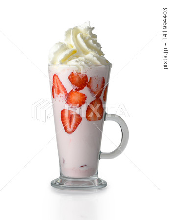 Tall glass of strawberry milkshake topped with whipped cream isolated on white Tall glass of strawberry milkshake topped with whipped cream isolated on white 141994403