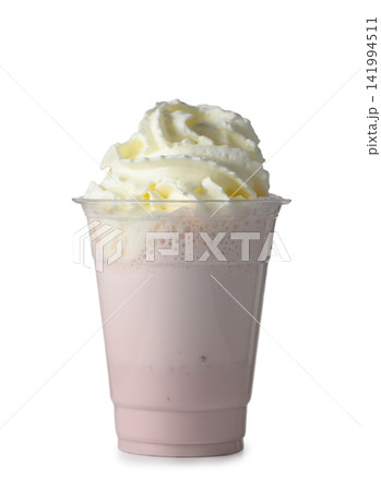 Disposable plastic cup of strawberry milkshake with whipped cream isolated on white Disposable plastic cup of strawberry milkshake with whipped cream isolated on white 141994511
