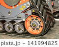 Heavy machinery tracks on a construction site during daytime hours 141994825