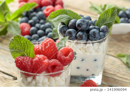 Curd dessert with berries and mint. Curd dessert with berries and mint. 141996094