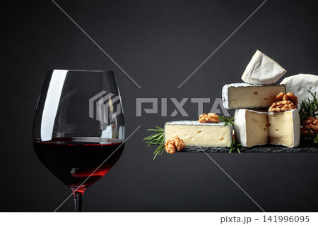 Red wine and soft cheeses with walnuts and rosemary. Red wine and soft cheeses with walnuts and rosemary. 141996095
