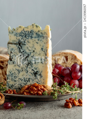 Gorgonzola with ciabatta, walnuts, red grapes, and thyme. Gorgonzola with ciabatta, walnuts, red grapes, and thyme. 141996097