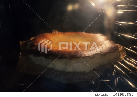 Decadent Basque Burnt Cheesecake Baking in Oven for Culinary Delight Decadent Basque Burnt Cheesecake Baking in Oven for Culinary Delight 141996880