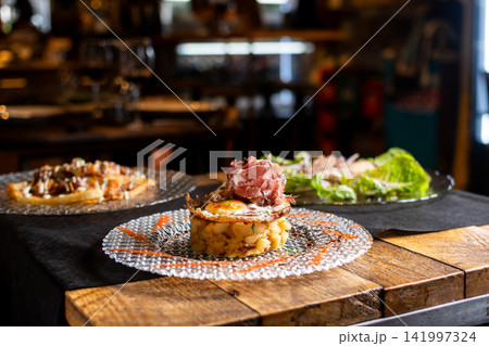 Gourmet dish on restaurant table Gourmet dish on restaurant table 141997324