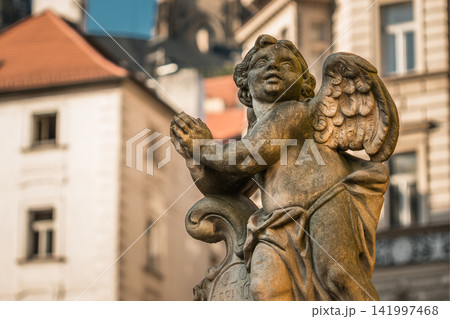 Close-up of historic stone angel statue in Prague city center 141997468