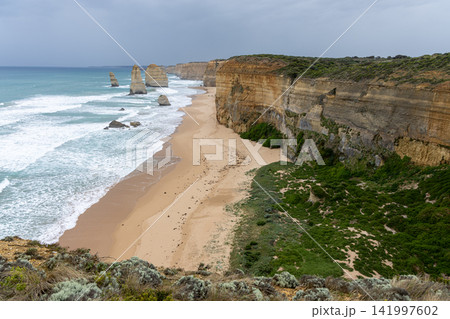 Twelve Apostles Coastline with Golden Cliffs and Sandy Beach Twelve Apostles Coastline with Golden Cliffs and Sandy Beach 141997602