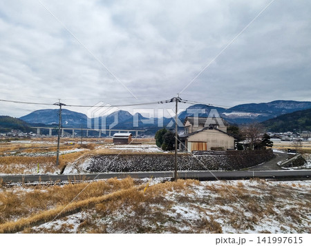 Rural Japanese Village with Snow-Capped Mountains in Winter Countryside Rural Japanese Village with Snow-Capped Mountains in Winter Countryside 141997615