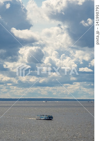 Passenger hydrofoil boat "Meteor" cruising on the Gulf of Finland under a cloudy sky. Passenger hydrofoil boat "Meteor" cruising on the Gulf of Finland under a cloudy sky. 141998791