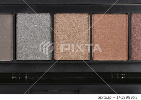 Eyeshadow palette close up with neutral shades Eyeshadow palette close up with neutral shades 141998955