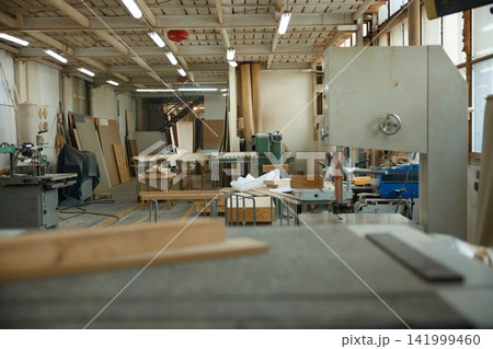 Abandoned carpentry space with equipment. Laboratory of woodcraft with manufacturing apparatus Abandoned carpentry space with equipment. Laboratory of woodcraft with manufacturing apparatus 141999460