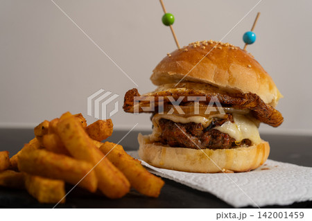 Double Cheeseburger with Fried Egg, Caramelized Onion and Fries 142001459