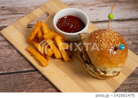 Delicious Double Burger with Fried Egg, Melted Cheese and Fries 142001470