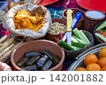 Traditional Healthy Snacks and Fresh Produce at an Outdoor Market 142001882
