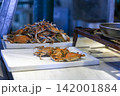 Traditional Healthy Snacks and Fresh Produce at an Outdoor Market 142001884