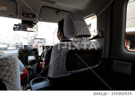 Interior of a Japanese taxi with driver and protective partition 142002914