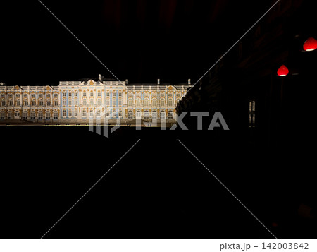 Catherine Palace features stunning baroque architecture illuminated at night, highlighting ornate details and vibrant colors against a dark sky Catherine Palace features stunning baroque architecture illuminated at night, highlighting ornate details and vibrant colors against a dark sky 142003842