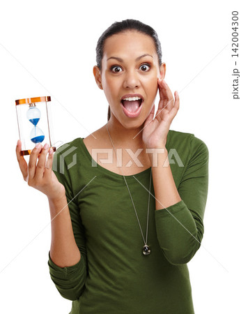 Portrait, woman and time with sand glass with surprised gesture or timer in studio. Shocked, person and hands on face for countdown of business deadline with hourglass minute on white background 142004300