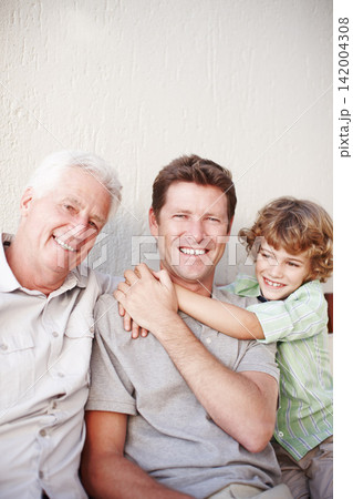 Father, kid and grandfather hug in portrait on a porch with love, support and bonding on vacation together. Happy family, face and male generations in backyard with solidarity, fun or holiday reunion Father, kid and grandfather hug in portrait on a porch with love, support and bonding on vacation together. Happy family, face and male generations in backyard with solidarity, fun or holiday reunion 142004308