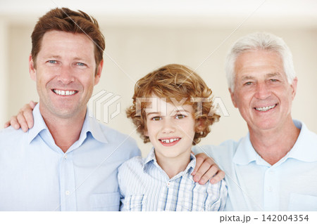 Boy, portrait and hug for family in home, support and happy for generations together in lounge. Male person, care and dad or grandpa in childhood, embrace and love in bonding or security in house 142004354