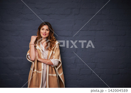 Fashion, beauty and portrait of woman by brick wall with stylish, trendy and elegant outfit. Cosmetic, winter and female model with classy clothes for style by dark black background with mockup. Fashion, beauty and portrait of woman by brick wall with stylish, trendy and elegant outfit. Cosmetic, winter and female model with classy clothes for style by dark black background with mockup. 142004589