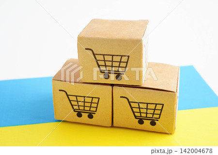 Online shopping, Shopping cart box on Ukraine flag, import export, finance commerce. 142004678