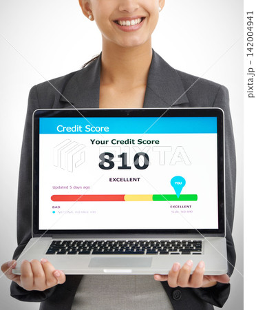 Woman, screen and laptop with loan application in studio for savings or budget information on internet with blue background. Digital nomad, fintech and approved or qualify for finance help and credit Woman, screen and laptop with loan application in studio for savings or budget information on internet with blue background. Digital nomad, fintech and approved or qualify for finance help and credit 142004941