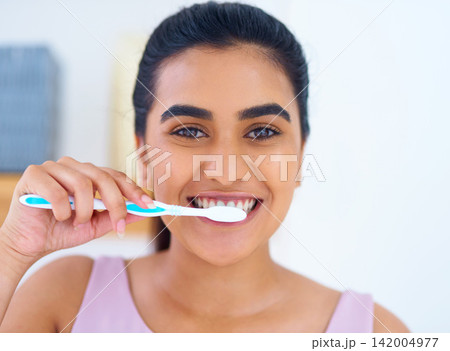Portrait, woman and toothbrush for brushing teeth in bathroom, dental health and wellness with routine at home. Oral hygiene, orthodontics and fresh breath with morning self care and tooth whitening 142004977
