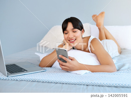 Woman, bed or phone to relax, laptop or social media by thinking, ebook or communication online. Happy, girl or search of idea, vision or planning of internet, post or update of news app on mockup 142005591