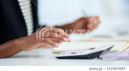 Accounting, woman and hand with calculator in office for company review, budget and analysis. Corporate, accountant and person with notebook at work for financial planning, tax return or bookkeeping Accounting, woman and hand with calculator in office for company review, budget and analysis. Corporate, accountant and person with notebook at work for financial planning, tax return or bookkeeping 142005697