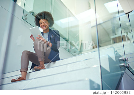 Business woman, happy and tablet on stairs in office for research, online search or social media. Female person, smile and professional with tech working on company report, blog post or web design 142005982