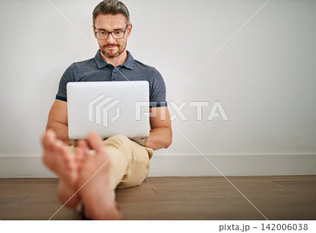 Man, blog and mockup with freelance on laptop for relax in casual with social media for internet with technology. Male person, glasses and house with online writing for website, reading and hustle 142006038