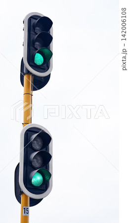 Traffic light, green and city intersection on street for go instruction, transportation or downtown. Road safety, commute and urban rules for traveling directions or infrastructure, driving or public Traffic light, green and city intersection on street for go instruction, transportation or downtown. Road safety, commute and urban rules for traveling directions or infrastructure, driving or public 142006108