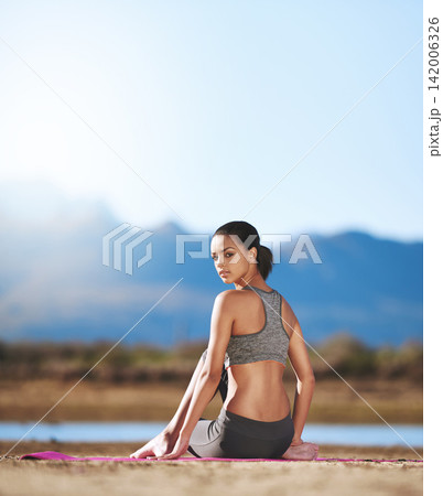 Rear view, woman and mat in outdoor for meditation, yoga practice, wellness and healthy recreation in tranquil environment. African person, sitting and portrait for calm, peace and relax on mockup 142006326