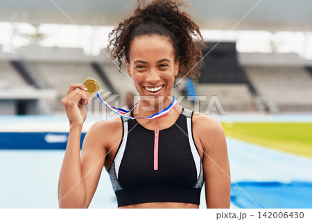 Black woman, athlete and happiness for medal stadium as champion for competition or game in Brazil. Portrait, winner and smile with prize or award for success, achievement and reward for sport career Black woman, athlete and happiness for medal stadium as champion for competition or game in Brazil. Portrait, winner and smile with prize or award for success, achievement and reward for sport career 142006430