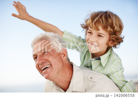 Happy, blue sky and child playing with grandfather for bonding, relationship and relax together outdoors. Family, nature and grandpa with young boy on summer holiday, vacation and weekend at park Happy, blue sky and child playing with grandfather for bonding, relationship and relax together outdoors. Family, nature and grandpa with young boy on summer holiday, vacation and weekend at park 142006558