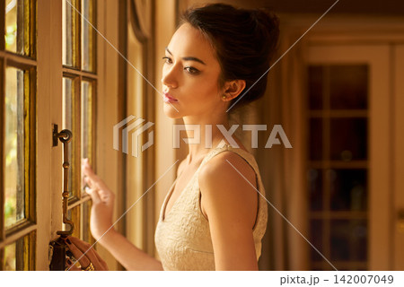 Fashion, window and thinking with woman in elegant home for gala event in style, classy and formal clothes. Wealth, aesthetic and person with confidence, pride and luxury in manor, house and mansion Fashion, window and thinking with woman in elegant home for gala event in style, classy and formal clothes. Wealth, aesthetic and person with confidence, pride and luxury in manor, house and mansion 142007049