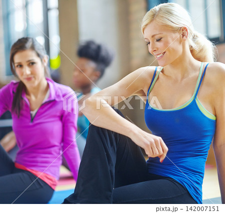 Stretching, fitness and woman in pilates health class for training, exercise and warm up on floor. Smile, muscles and female person getting ready for flexibility workout, yoga or wellness Stretching, fitness and woman in pilates health class for training, exercise and warm up on floor. Smile, muscles and female person getting ready for flexibility workout, yoga or wellness 142007151